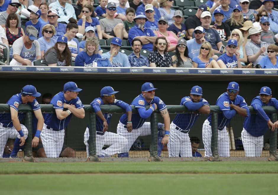 Baseball players waiting in the dugout.