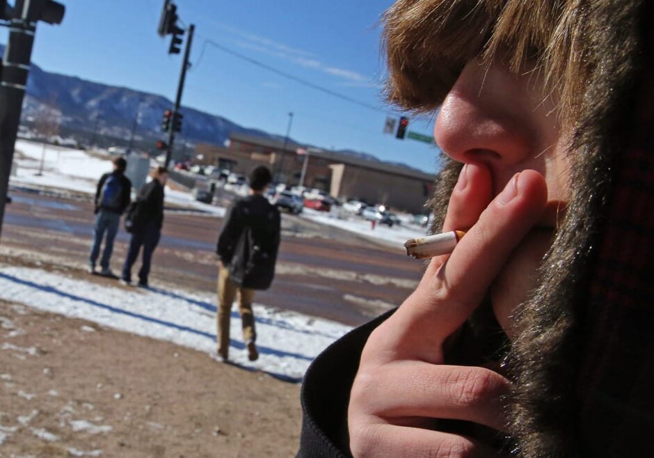 HIgh school student smoking a cigarette