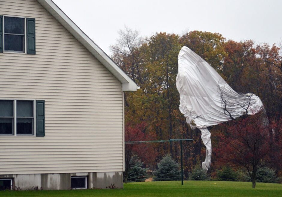 Part of an unmanned Army surveillance blimp hangs off a group of trees after crash landing near Muncy, Pa.  on Wednesday, inspiring at least one copycat crime. (Photo: Ken Hunter via AP)