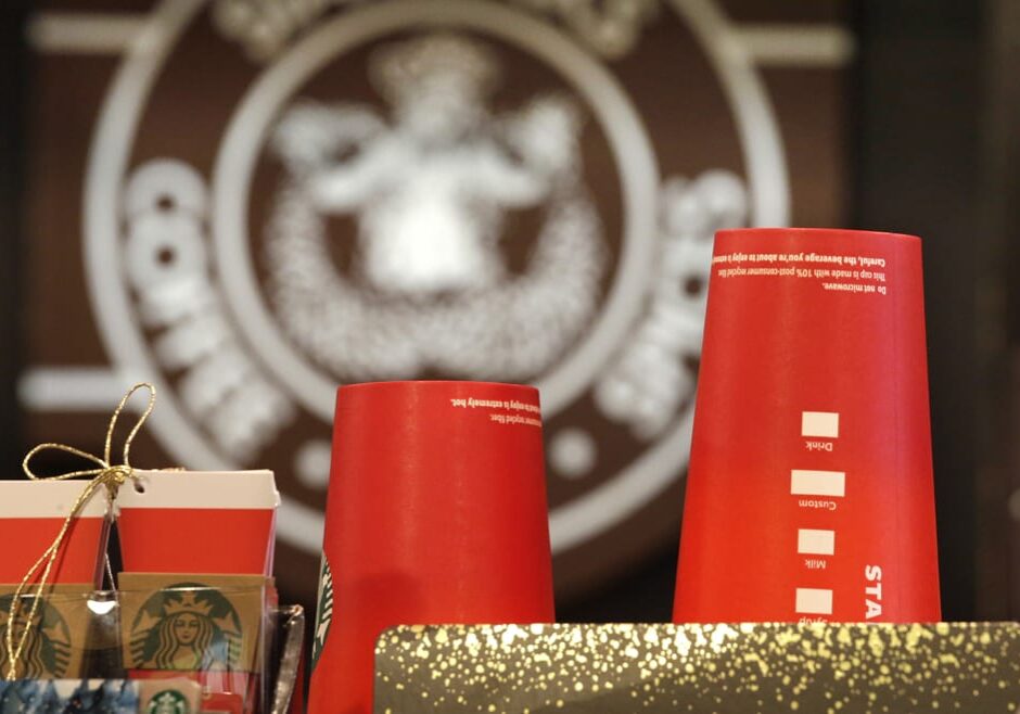 It's as red as Santa's suit, a poinsettia blossom or a loud Christmas sweater. Yet Starbucks' minimalist new holiday coffee cup has set off complaints that the chain is making war on Christmas. (Photo: Elaine Thompson | AP)