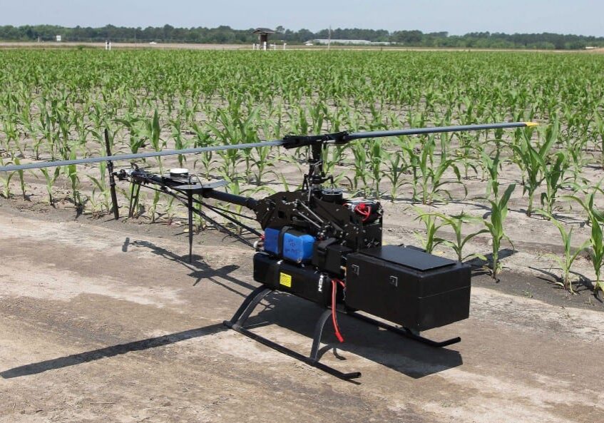 In this Monday, May 19, 2014 photo, an unmanned aerial vehicle equipped with a multi-spectral camera awaits takeoff at the Southeastern Agricultural Center's research farm in Moultrie, Ga. The technology developed by a Georgia consortium is designed to monitor crop vigor, insect infestation and fungal infection for the agriculture industry. (AP Photo/Johnny Clark)
