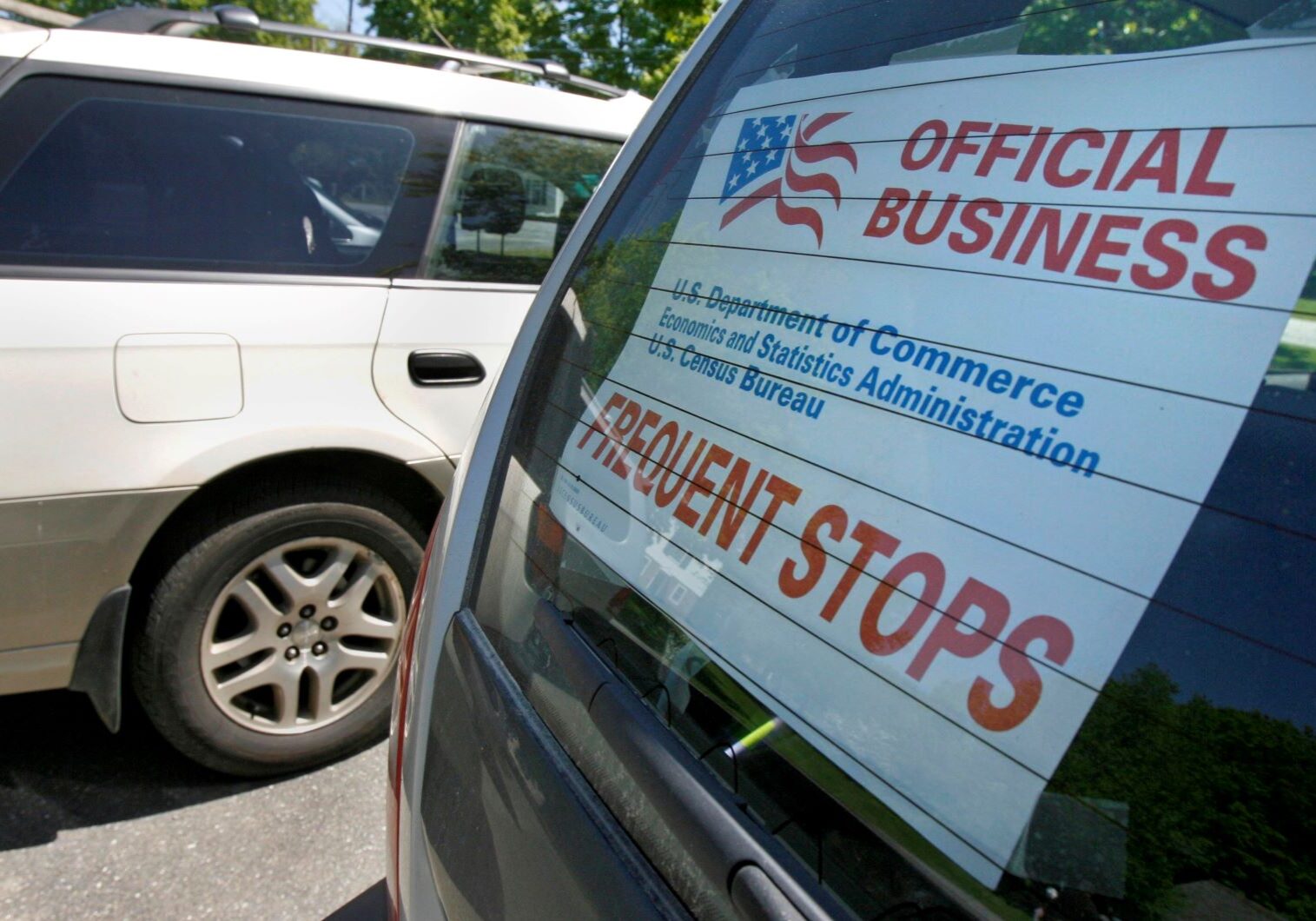 A sign marks the vehicle of a census enumerator.