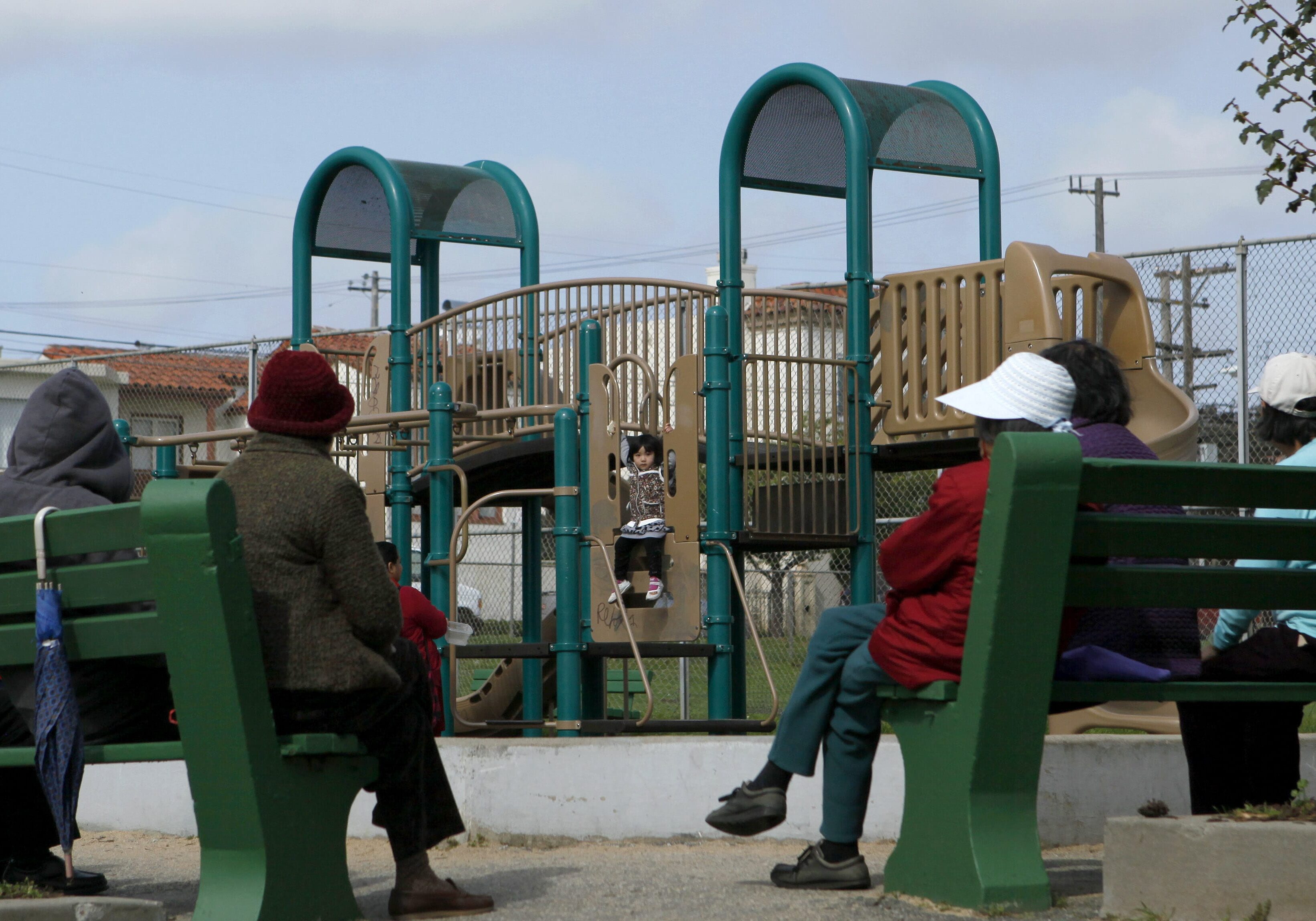** ADVANCE FOR SUNDAY, MARCH  20 **  Women watch as children play at Palega Recreation Center and Playground in San Francisco, Thursday, March 17, 2011. Over the objections of organized labor and its neighboring bedroom communities, San Francisco is moving forward with what is billed as the nation's toughest hire locally ordinance. The law, which takes effect March 25, requires contractors on municipal construction projects to initially select 20 per cent of their workers from the ranks of city residents. (AP Photo)