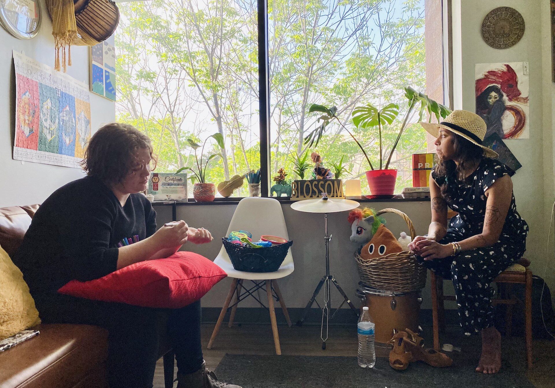 Atticus said he's grateful to his therapist, Sindhu Fedosyuk, for helping him embrace coming out. He said one emotional moment was when she helped wash and style his hair. (Vicky Diaz-Camacho | Flatland)