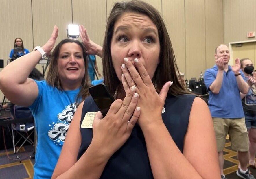 Kansas state Rep. Stephanie Clayton, an abortion rights supporter who was a Republican and is now a Democrat, reacts as a referendum to strip abortion rights out of the state constitution fails.