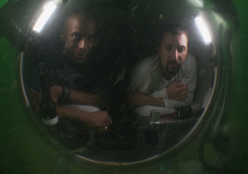 Image of Dr. Lewis and another man in a submarine.