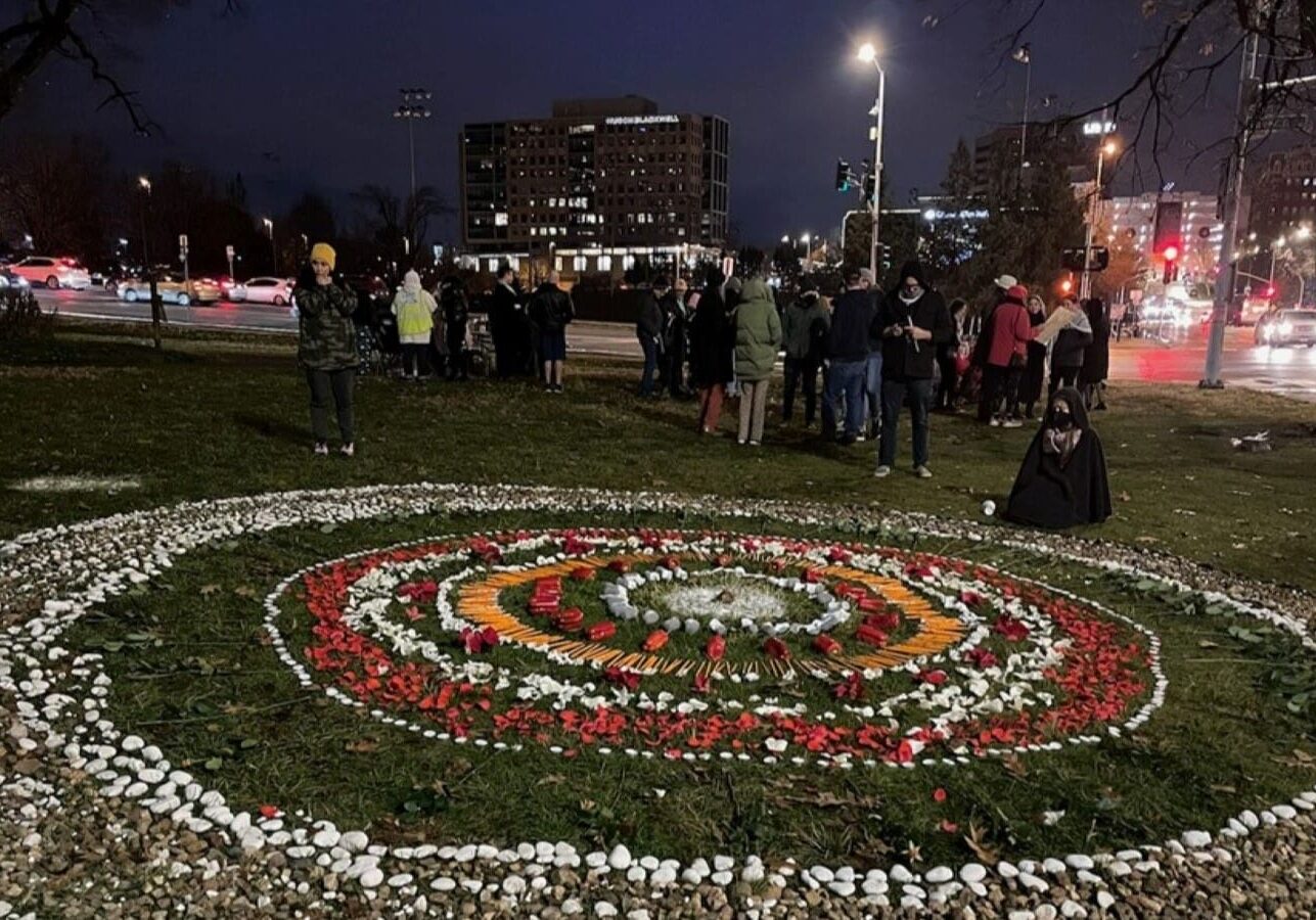 A tribute at Mill Creek Park presses for a ceasefire to the bombings in Gaza and the deaths of Palestinian civilians. The design includes stones, rose petals and even pencils and children's socks, which were to note the deaths of children.