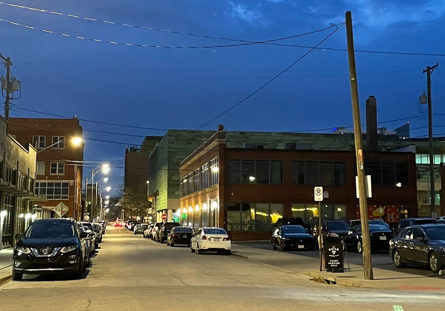 Cars parked on the streets in the Crossroads.