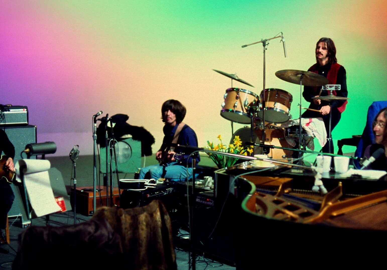 This image released by Disney+ shows, from left, Paul McCartney, George Harrison, Ringo Starr and John Lennon in a scene from the nearly 8-hour Peter Jackson-produced documentary "Get Back."