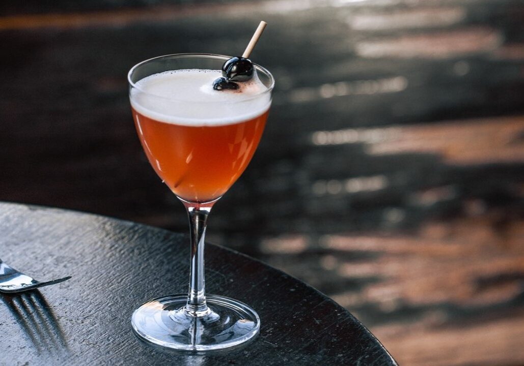 A craft cocktail on a table.