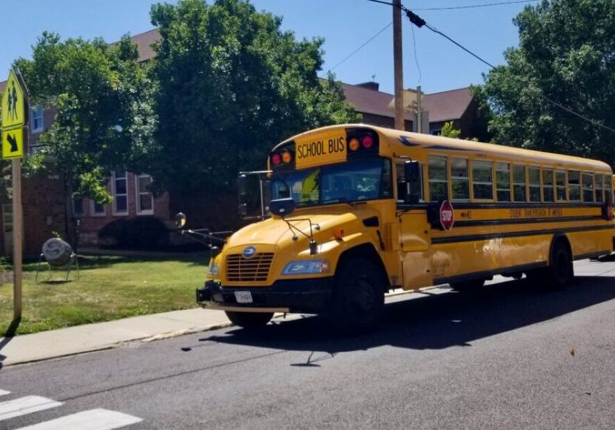 School buses wait Tuesday outside Thomas Hart Benton Elementary School in Columbia to take students home from the first day of classes.
