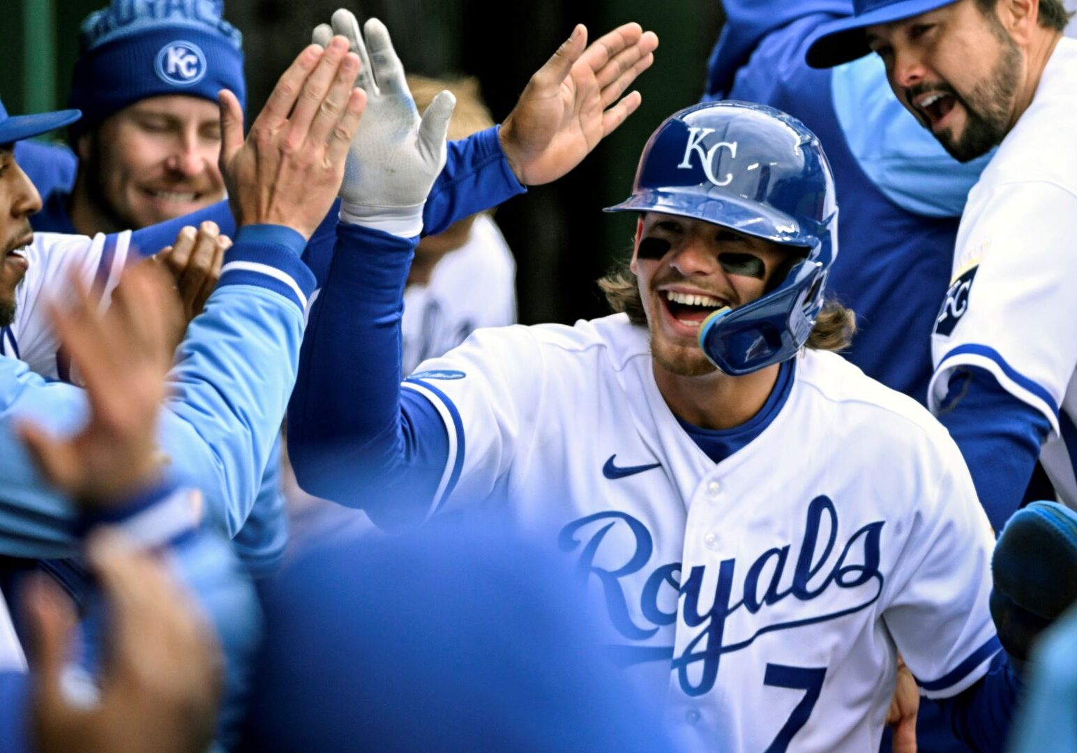 Kansas City Royals' Bobby Witt Jr. (7) is congratulated after scoring a run against the Cleveland Guardians during the eighth inning of a baseball game, Thursday, April 7, 2022 in Kansas City, Missouri.