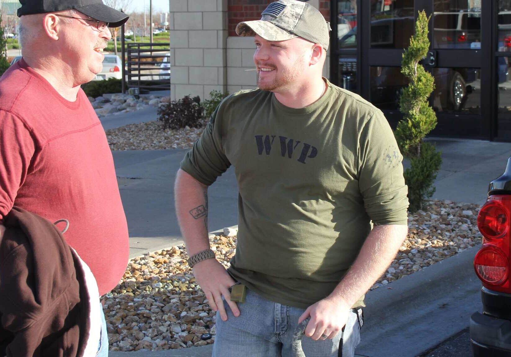 U.S. Army veteran Brandon Garrison, right, talks with his father, Stephen Traglio, who also served in the Army. Garrison served in Afghanistan and now has several health conditions that he says may be linked to the burn pits used to dispose of waste at U.S. military bases there.
(Photo: Andy Marso / KHI News Service)