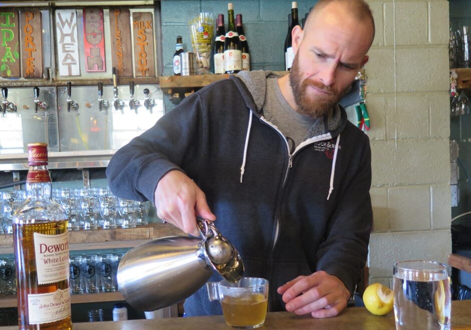 Bartender Sam Shepard serves a hot worty