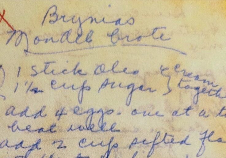 A Handwritten recipe of discolored paper written in blue ink.