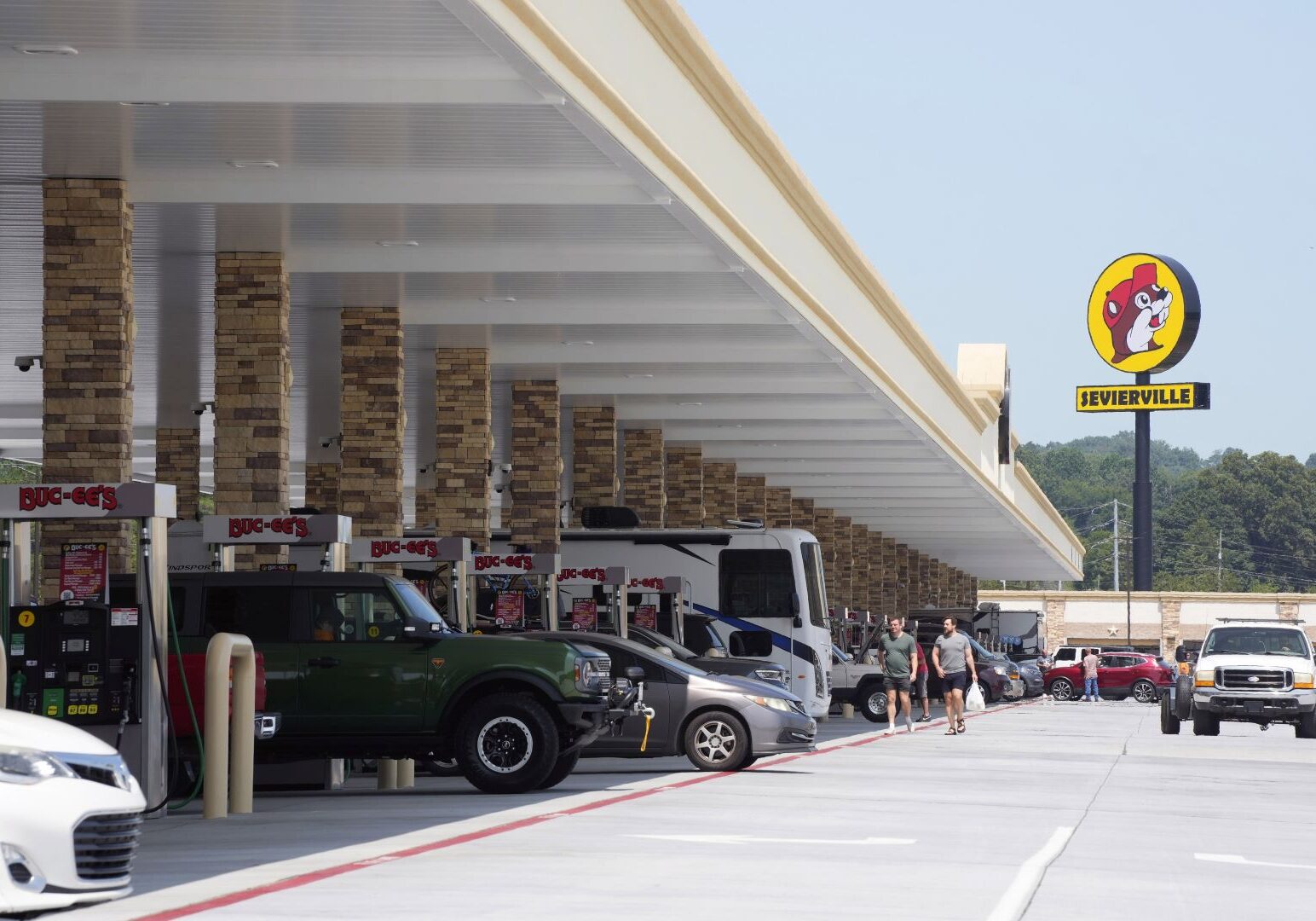 Cars and trucks fuel up at a massive Buc-ee's gas station and convenience store.