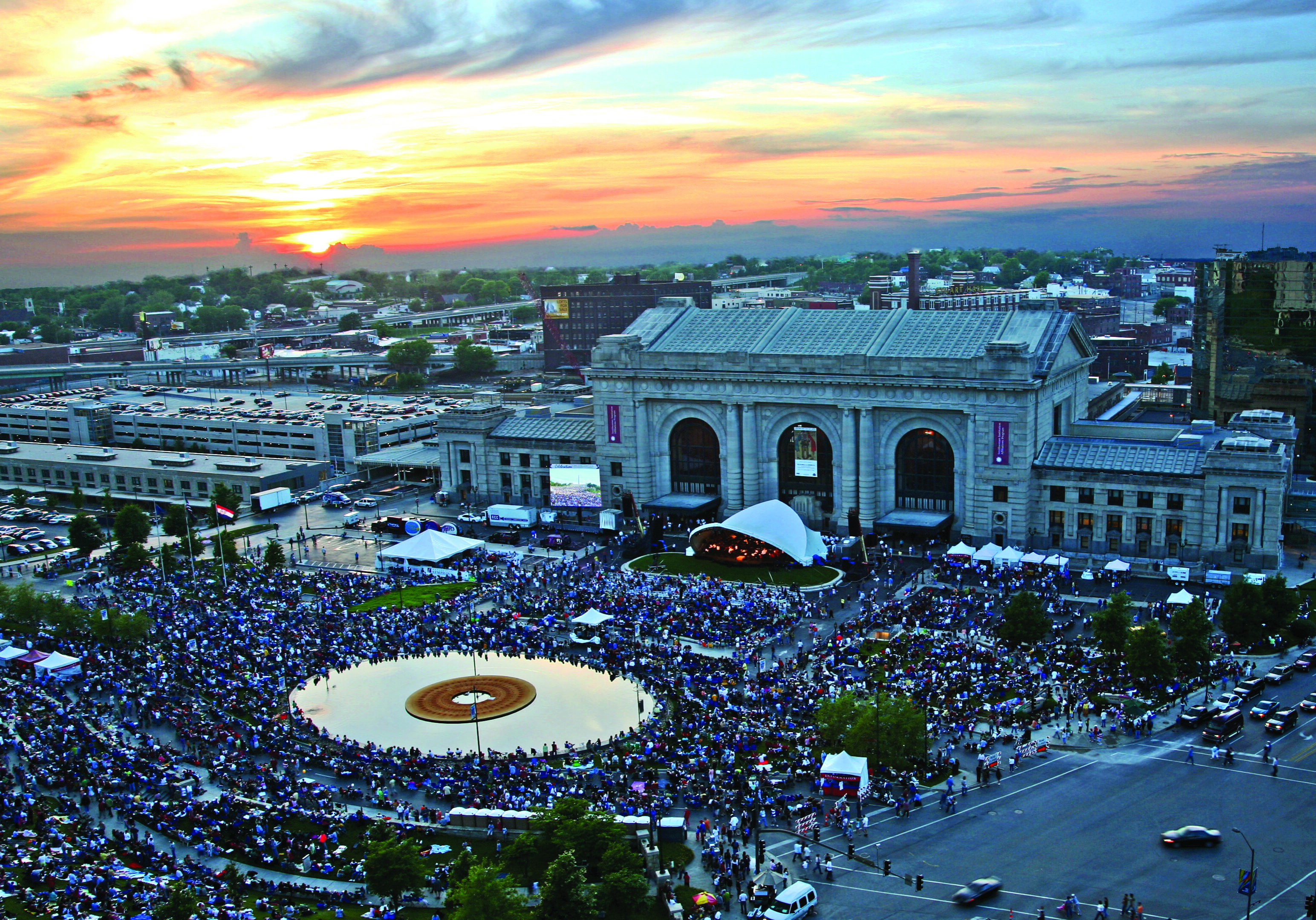 A crowd of people outside of Union Station listening to the symphony
