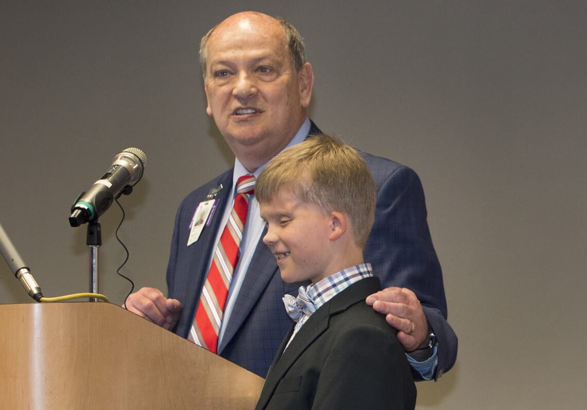 Children's Mercy CEO with former patient Charlie Walsh