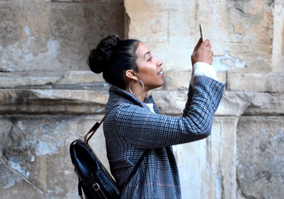 Woman taking photo with her smart phone