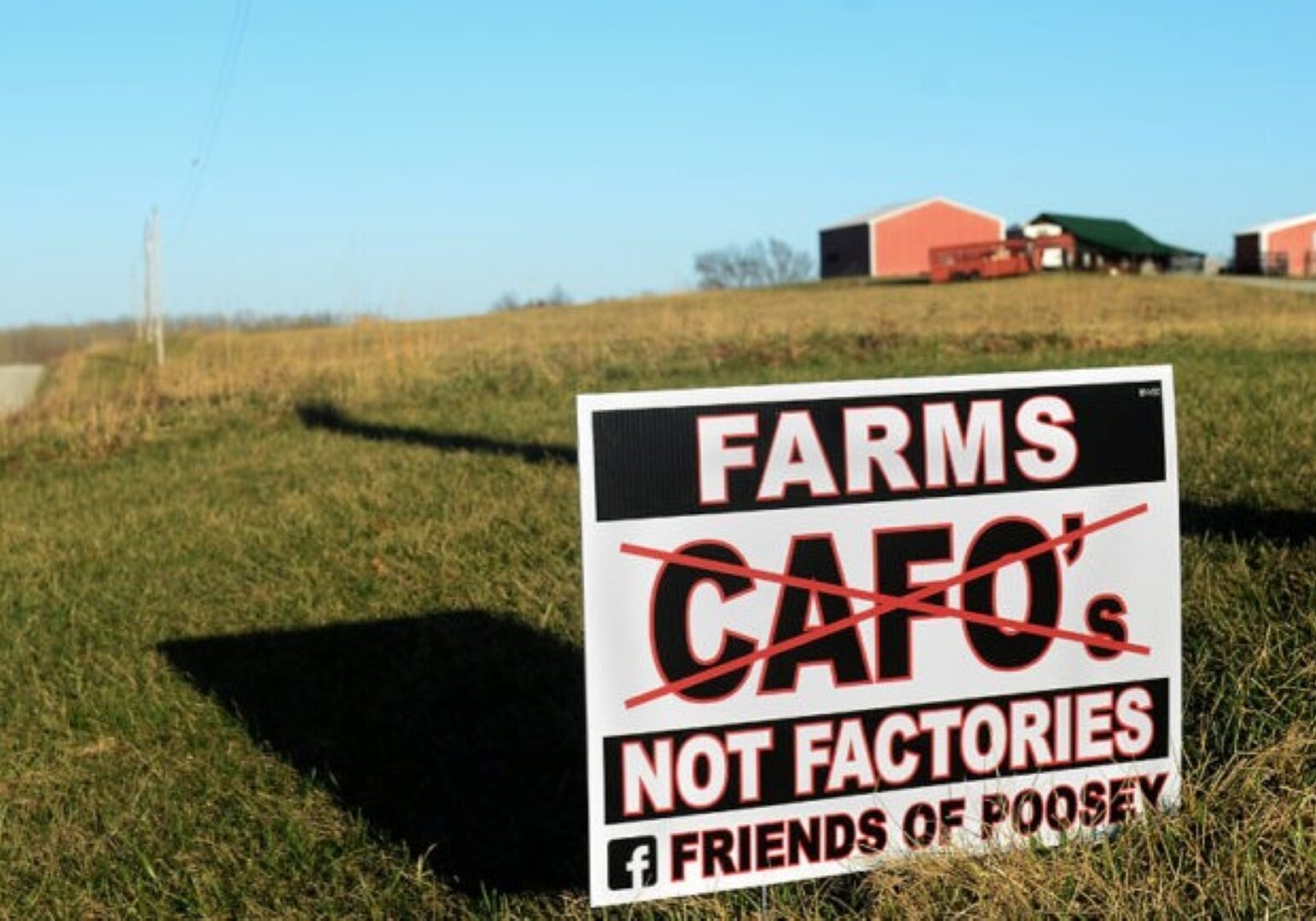 Bert Wire's farm sits behind the "Farms Not Factories" sign near Chillicothe, Missouri,