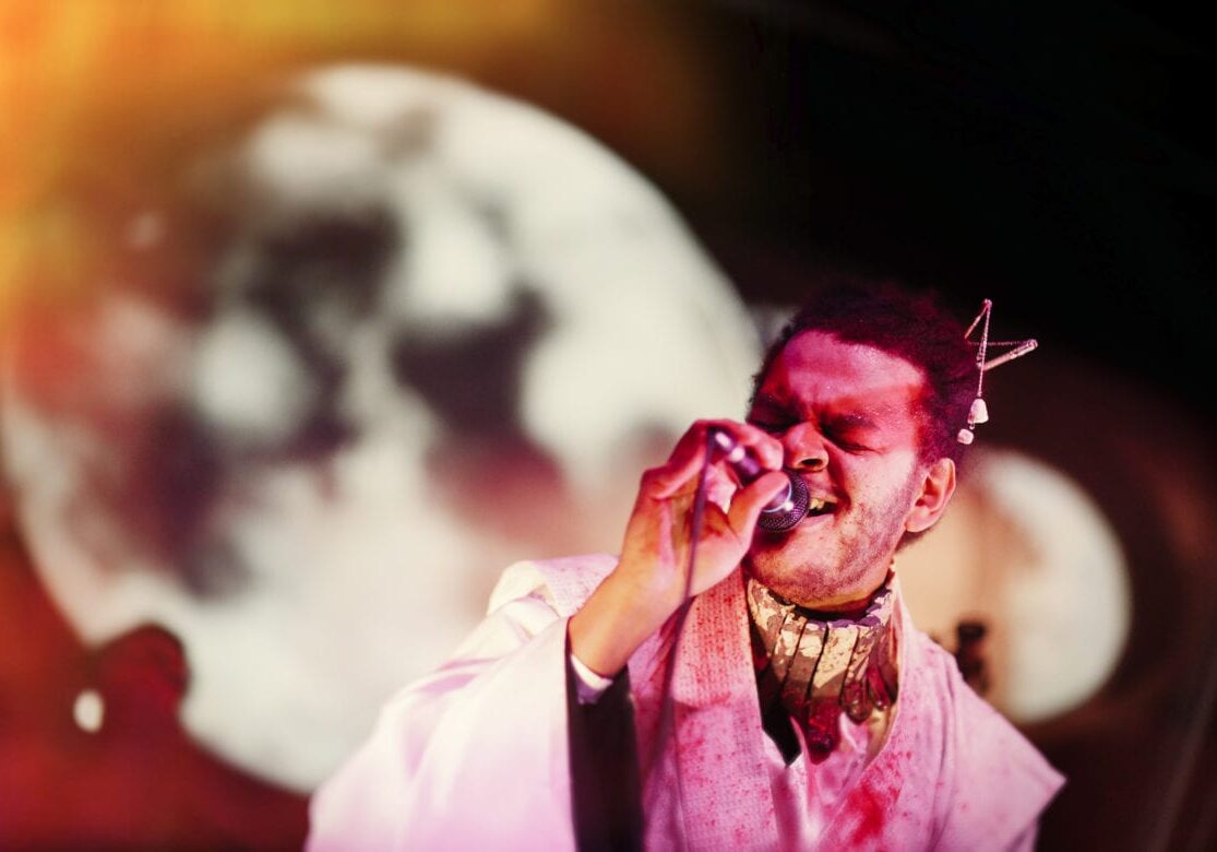 A man singing into a microphone.