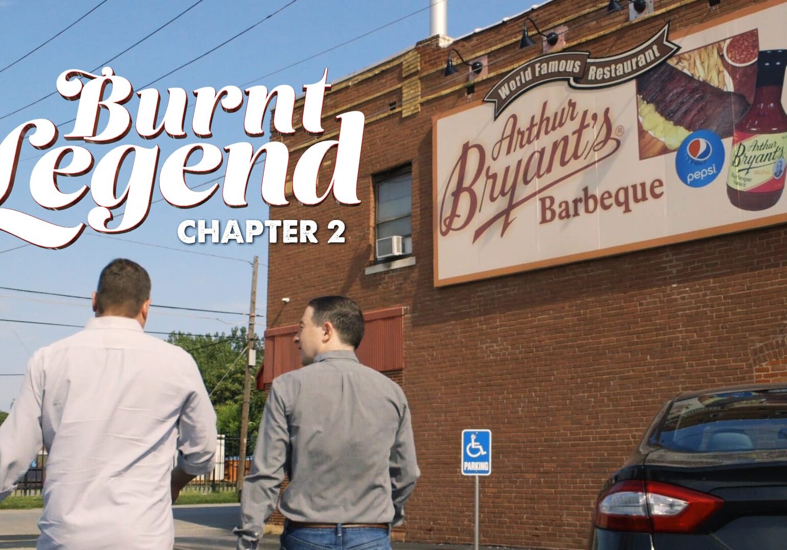 Two men walking int a BBQ joint