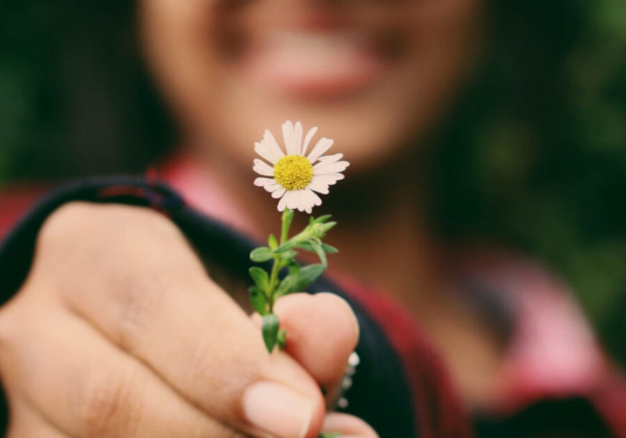 Kid holding flower