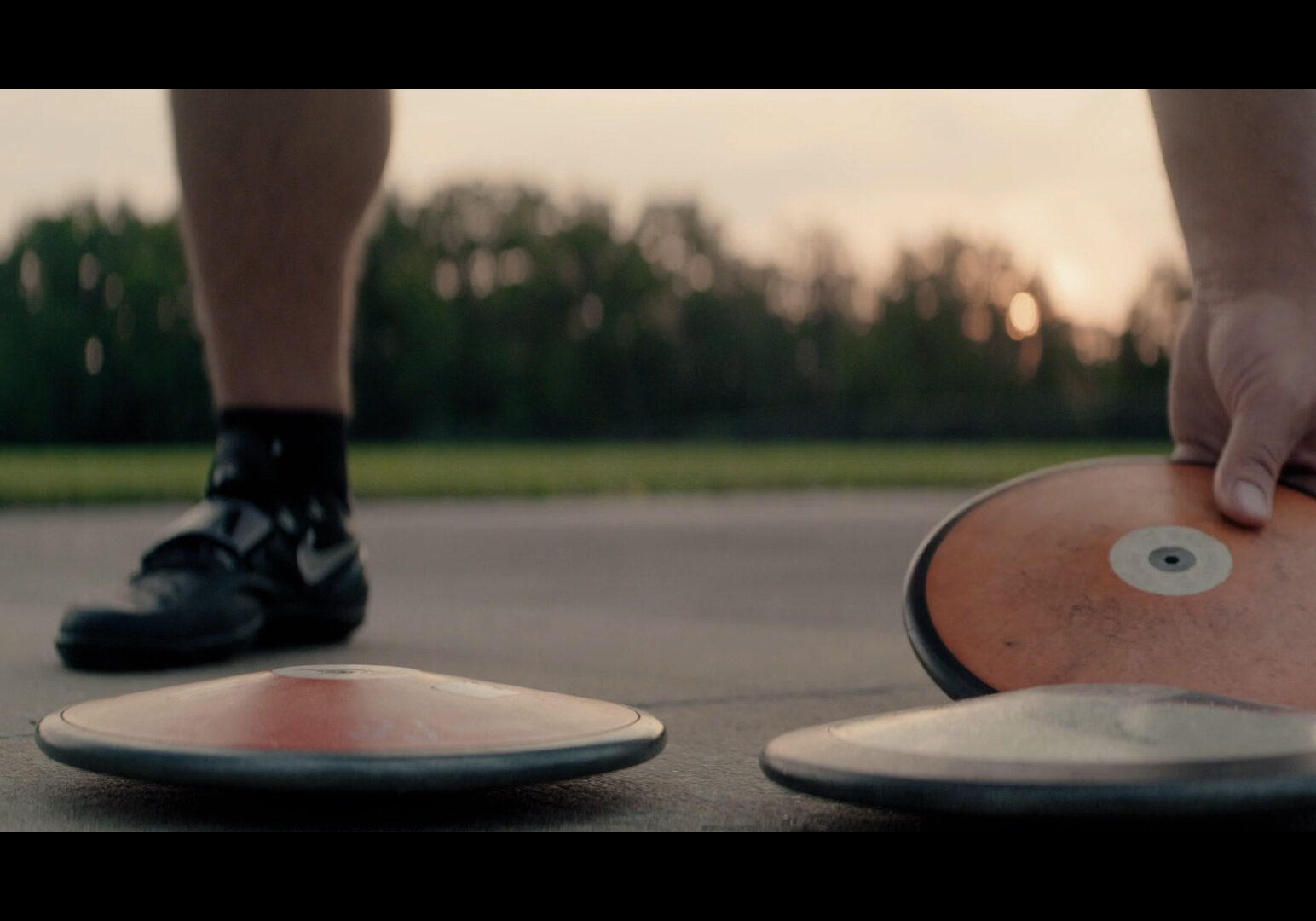 Mason Finley prepares to throw the discus in a scene from "Chasing Gold."