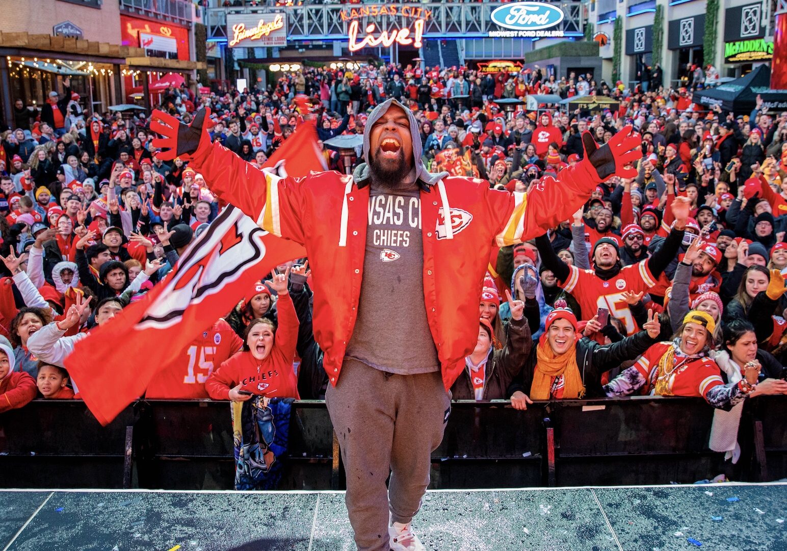 Kansas City rapper Tech N9ne poses on stage at the KC Live! Chiefs watch party