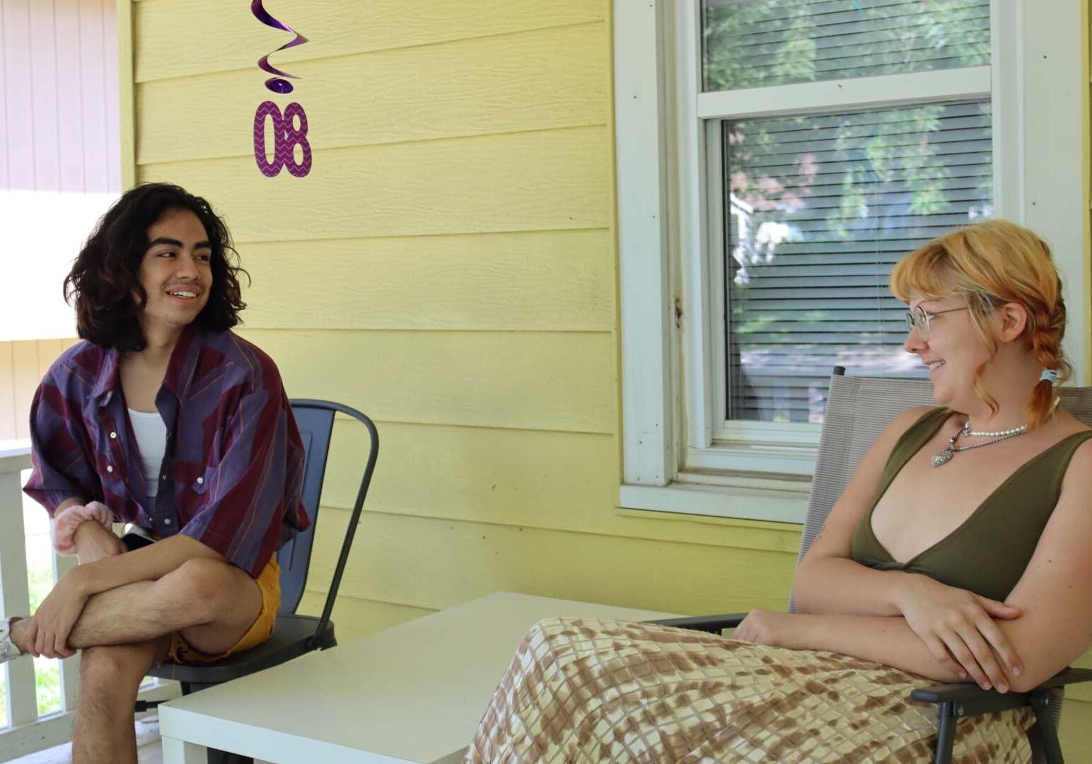 Fabian Rosales (left) and roommate Emma Hopkins hope to return to their rental house in Lawrence after the repairs to their plumbing are finished.