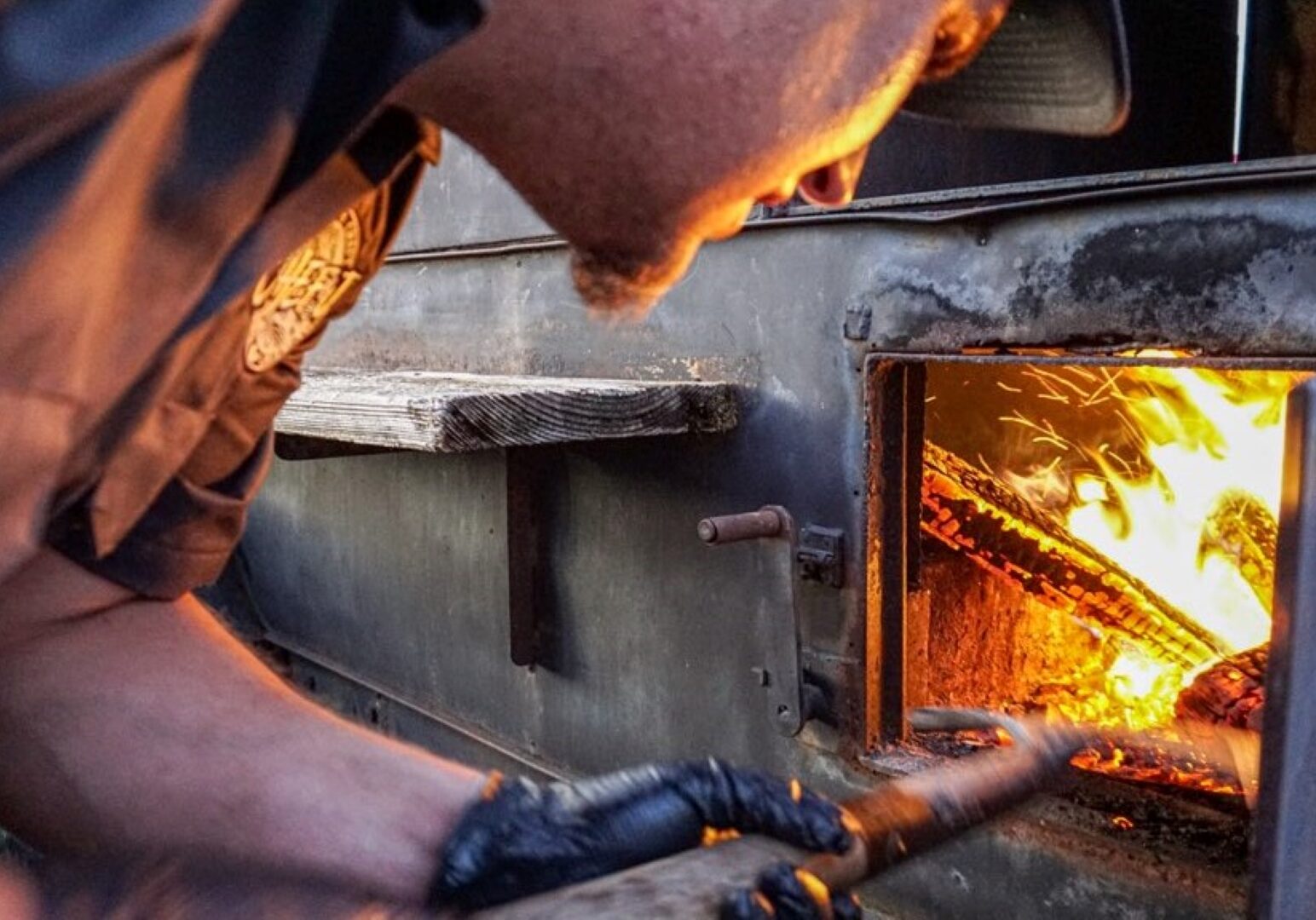 Justin Easterwood of Chef J BBQ in the West Bottoms manages the fire.
