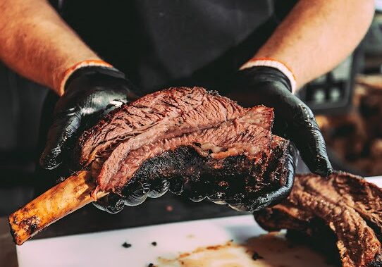 Pitmaster John Atwell of Jousting Pigs BBQ in Liberty does a Texas-style smoked brisket that exemplifies the motto “competition meets craft.”