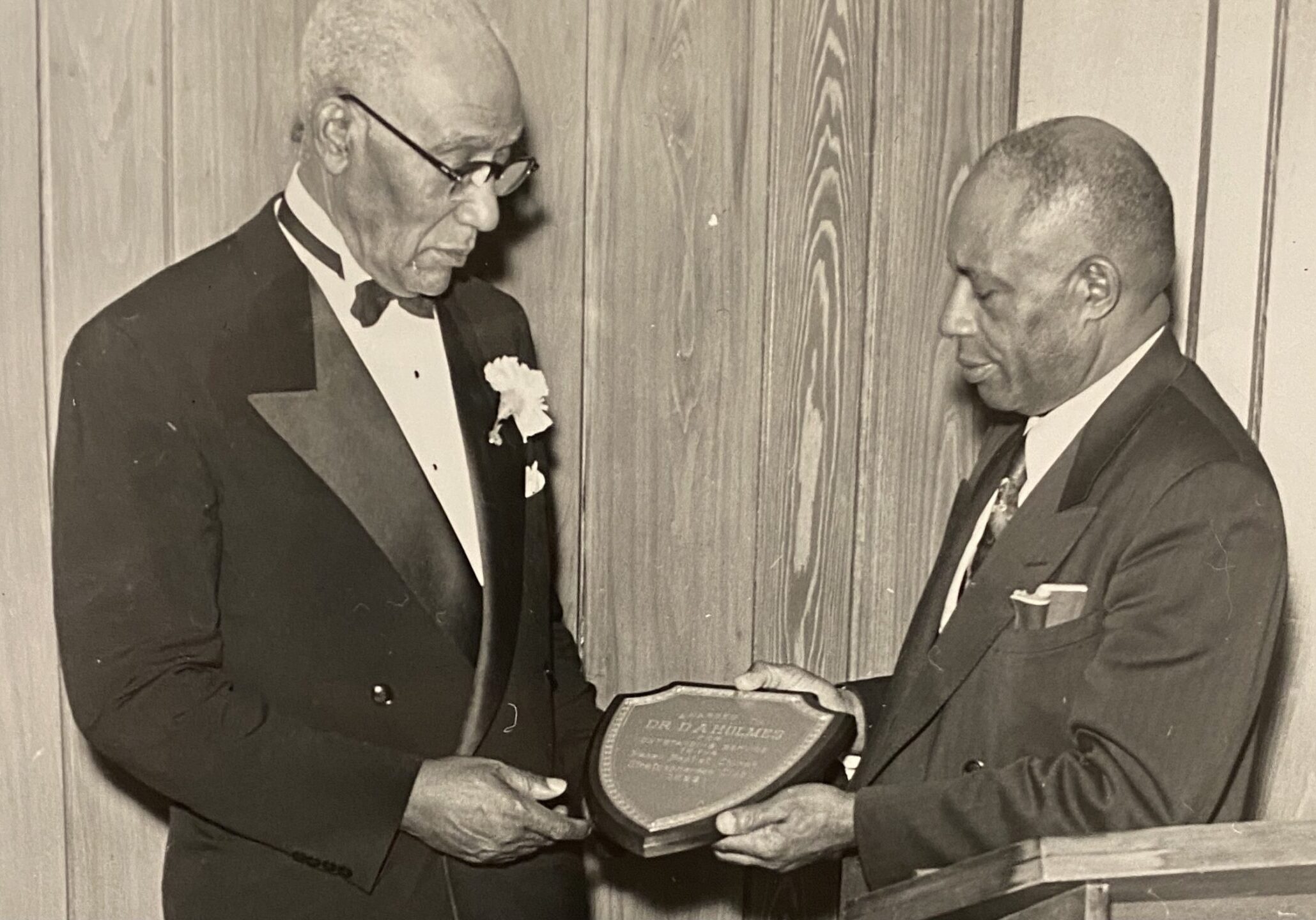 The Rev. D.A. Holmes (left) receiving an award.