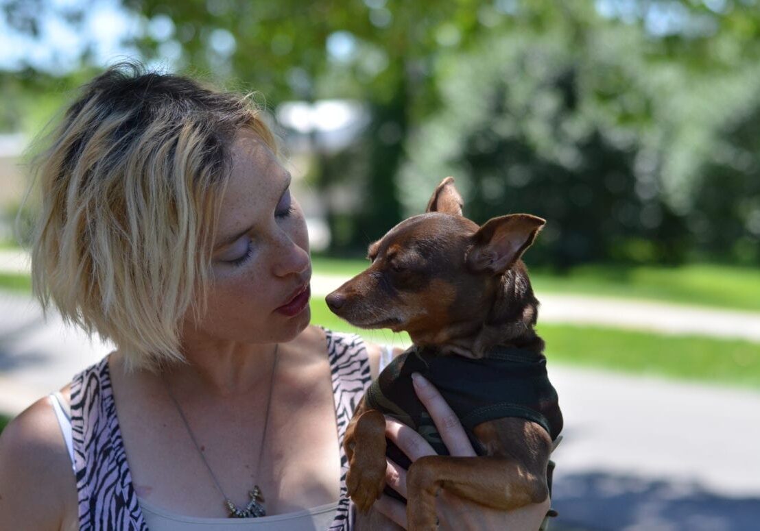 A woman with her dog.