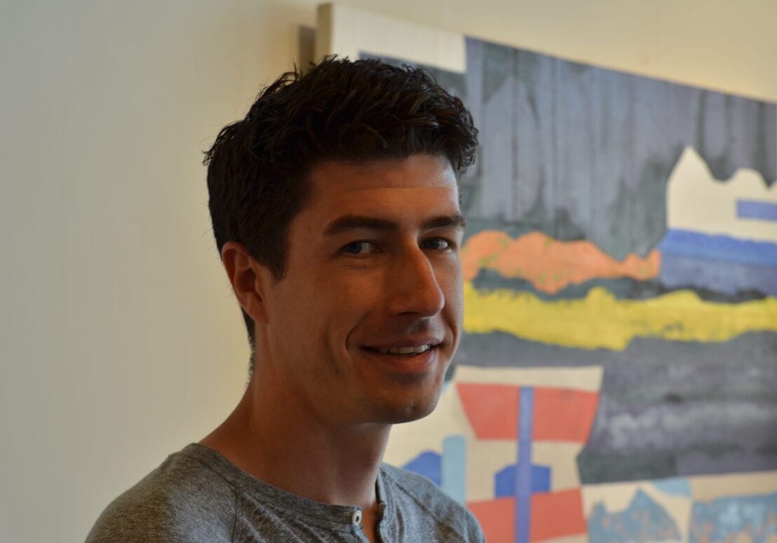 A man stands in his office.