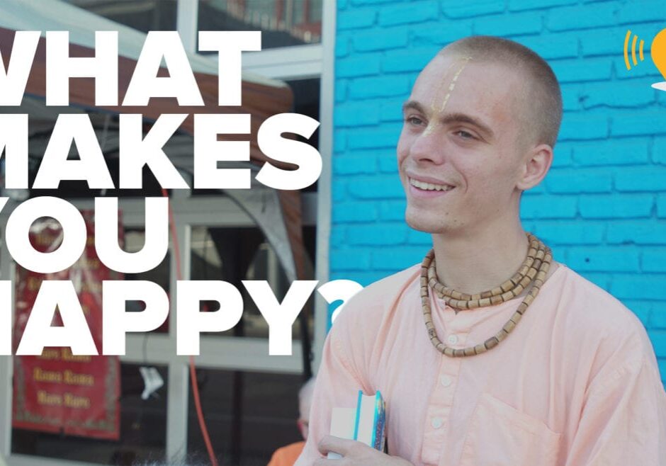 a man against a blue wall