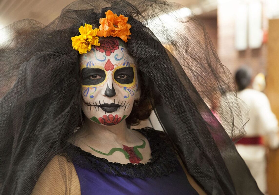 Maria Munoz, West Wyandotte Library Spanish Language Associate, as La Catrina, a recognized symbol for The Day of the Dead in Latin America. A team that included library staff, volunteers, dancers, and make-up stylists helped celebrate a traditional Día da los Muertos at West Wyandotte Library, Nov. 2, 2015. (Photo: Oliver Bohanon | Flatland)