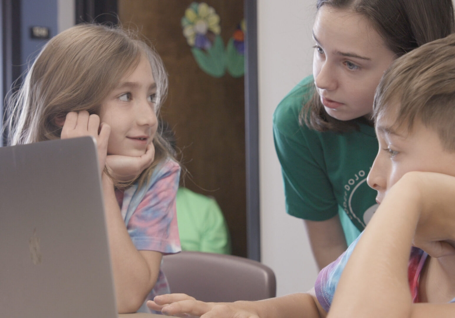 Picture of three children and a laptop computer.