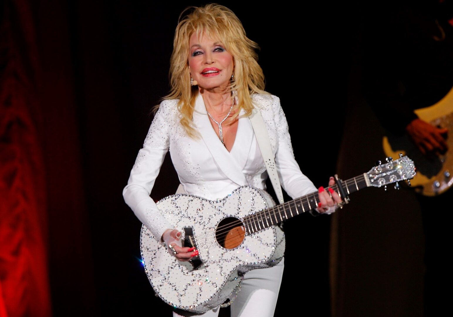 In this July 31, 2015 file photo, Dolly Parton performs in concert at the Ryman Auditorium in Nashville, Tenn. (Photo by Wade Payne/Invision/AP, File)