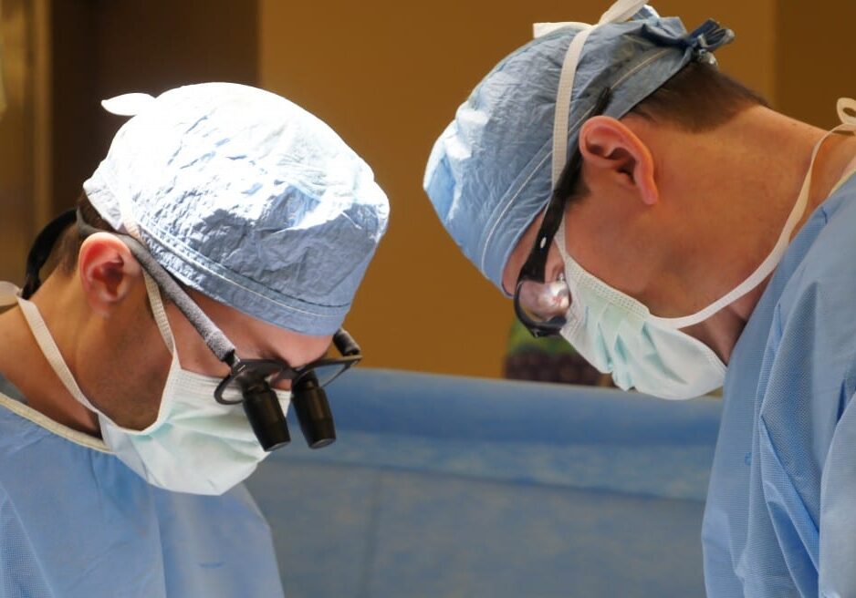 Dr. Timothy Schmitt, left, and Dr. Sean Kumer perform a liver transplant at KU Hospital.
(Photo courtesy of University of Kansas Hospital)