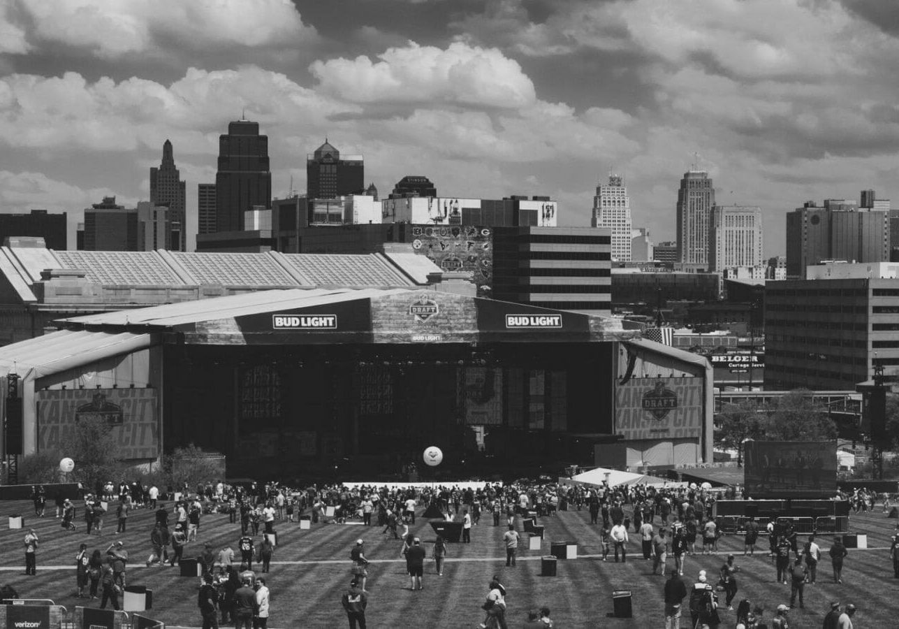 A crowd begins to gather in front of Union Station for the start of the NFL Draft.