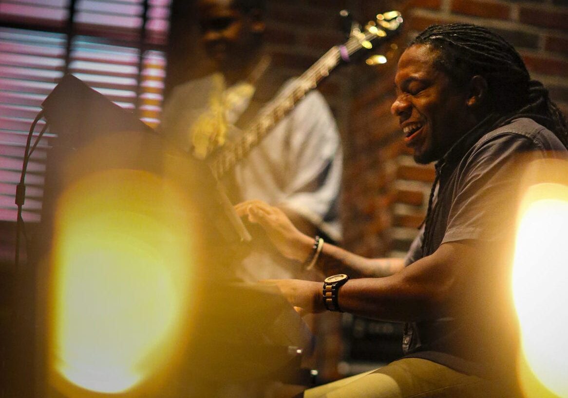 A man playing in a band.