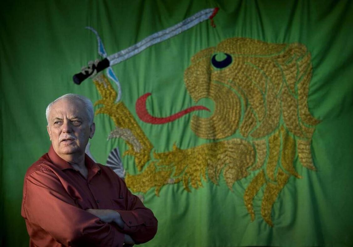 John Millar is the pastor and leader of Elohim City. A flag bearing the symbol of the Hebrew tribe of Judah, from which they believe they’re descended, hangs in their church. Christian Identity followers believe white Anglo-Saxons, not Jews, are God’s chosen people. (Photo by Keith Myers/The Star)