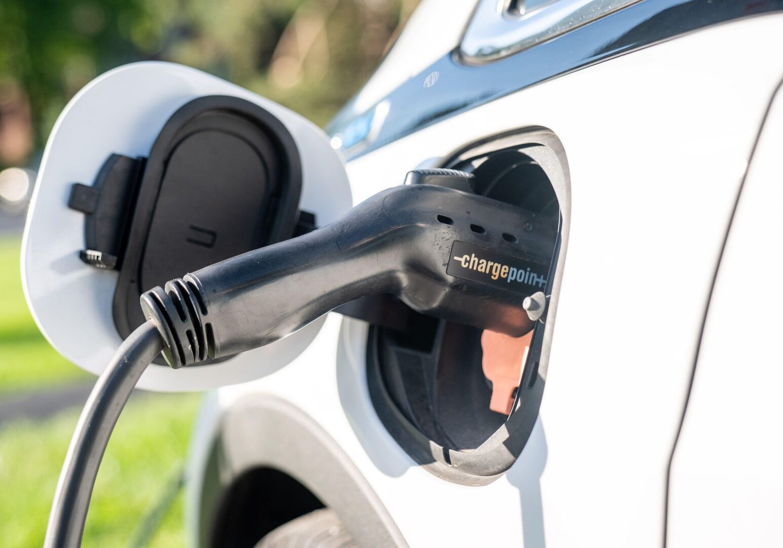 An electric vehicle as it is being charged.