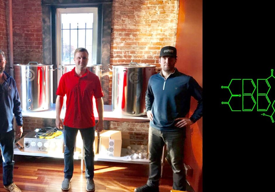 three men standing in a room