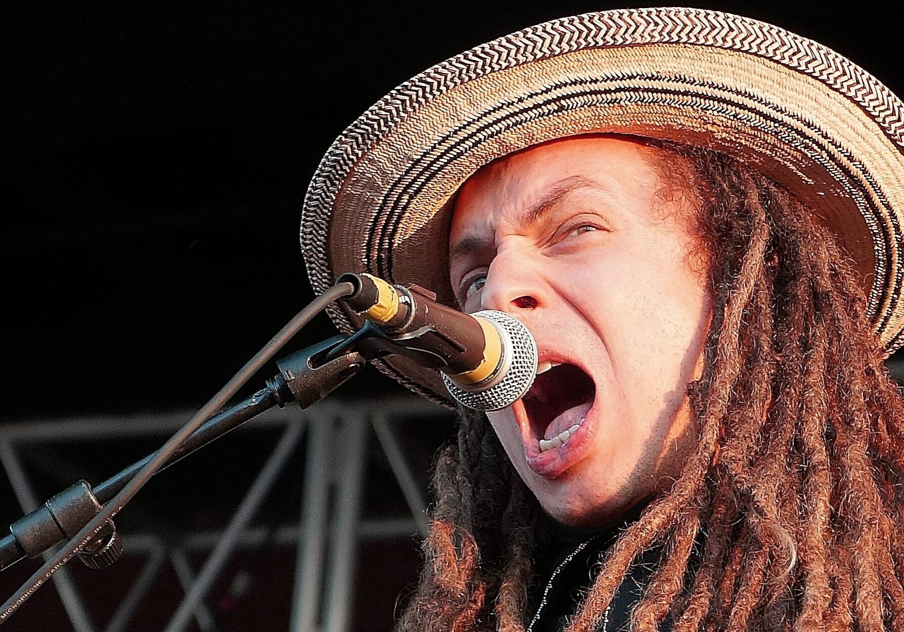 A man singing into a microphone.