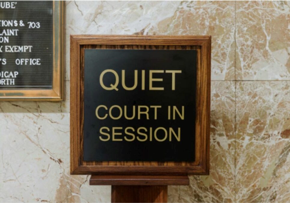 A "Quiet Court in Session" sign.