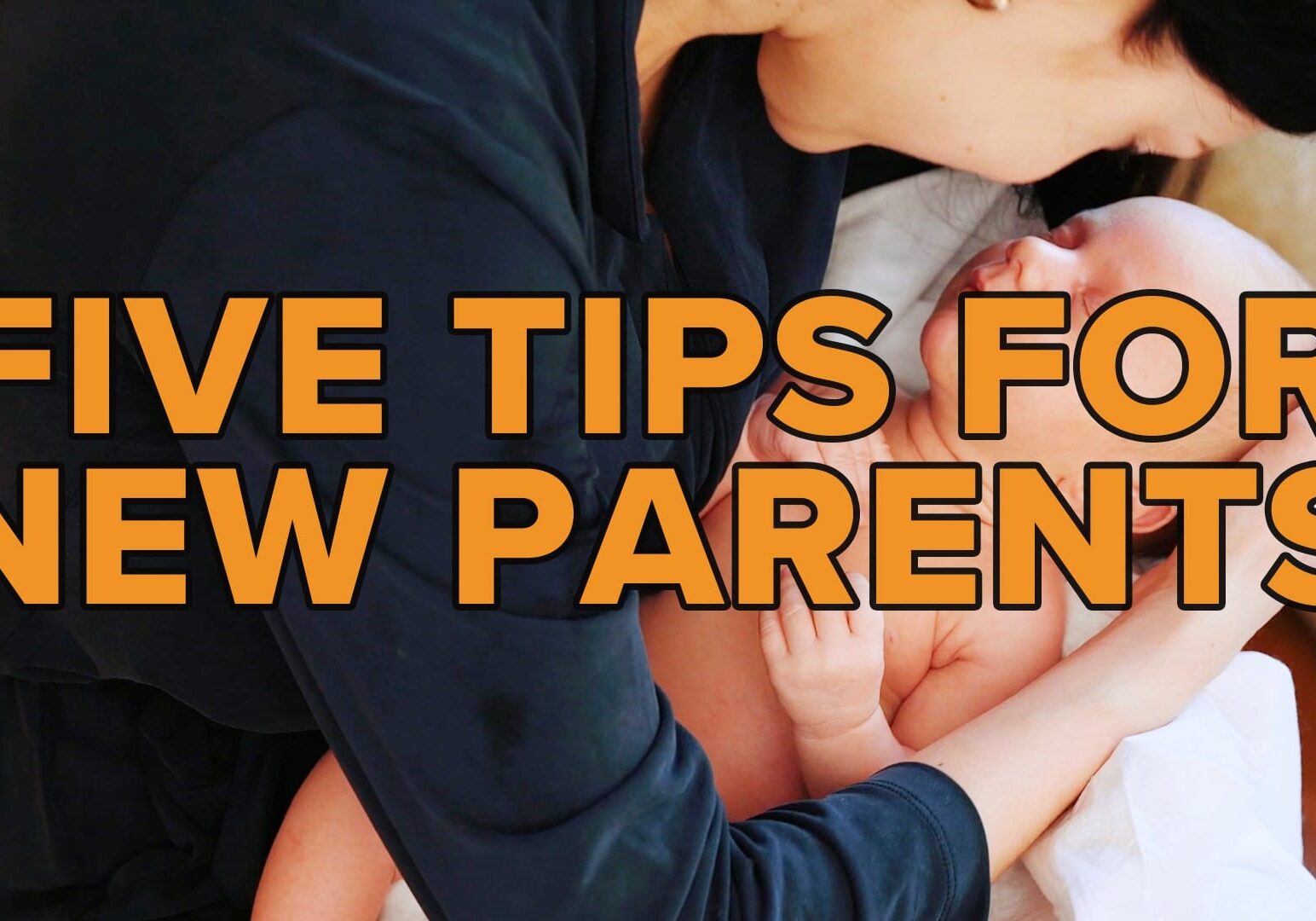 A parent holds a baby.