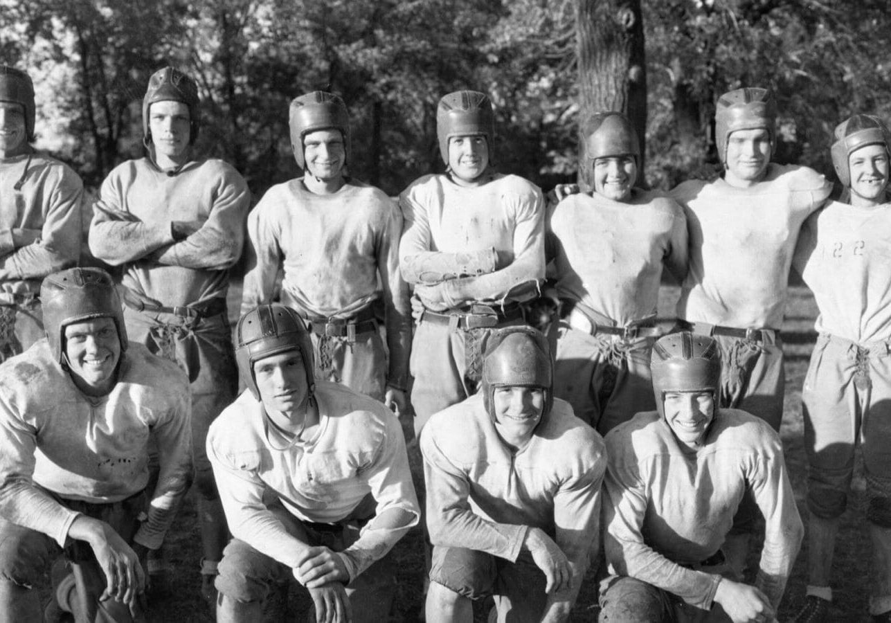 By the mid-1930s Kansas City area high school football players, like these members of the William Chrisman High School football squad in Independence, competed while wearing helmets and protective padded apparel.