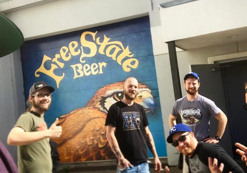 Central Standard and Free State recently collaborated on a beer. From left to right: head brewer Geoff Deman, packaging line specialist Skylar Rexwinkle, brewer/packaging line manager Luke Otter, and brewer/lab technician Logan Carter of Free State. Sitting: Central Standard co-owners/brewers Ian Crane and Nathan Jackel. Not pictured: Jimmy Vo of Kan-Grow Hydro Farm and Free State assistant brewer Kevin Prescott. (Courtesy of Free State Brewing Company)